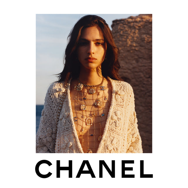 Woman wearing CHANEL knit top  