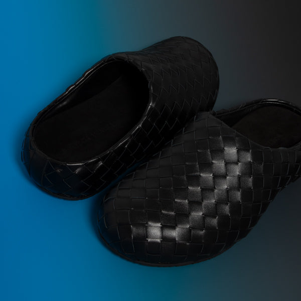 A pair of Bottega veneta black Intrecciato leather slip-on clogs