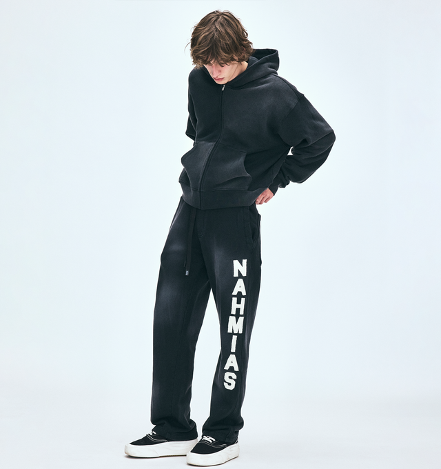 Image 5 of 5 - BLACK - NAHMIAS Applique Baggy Sweatpants featuring baggy fit, elstic waistband, Nahmias drawcord and logo motif applique on leg. 100% cotton.  