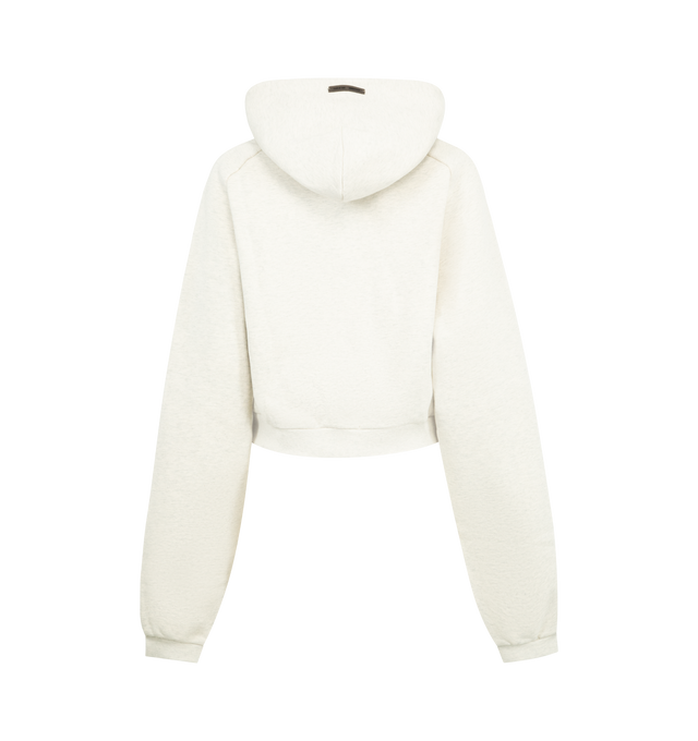 Image 2 of 3 - WHITE - FEAR OF GOD ESSENTIALS 90s Raglan Hoodie featuring cotton-blend fleece hoodie, oversized, rubber logo patch at hood, logo embossed at front, seam pockets, rib-knit cropped hem and cuffs and raglan sleeves. 80% cotton, 20% polyester. 