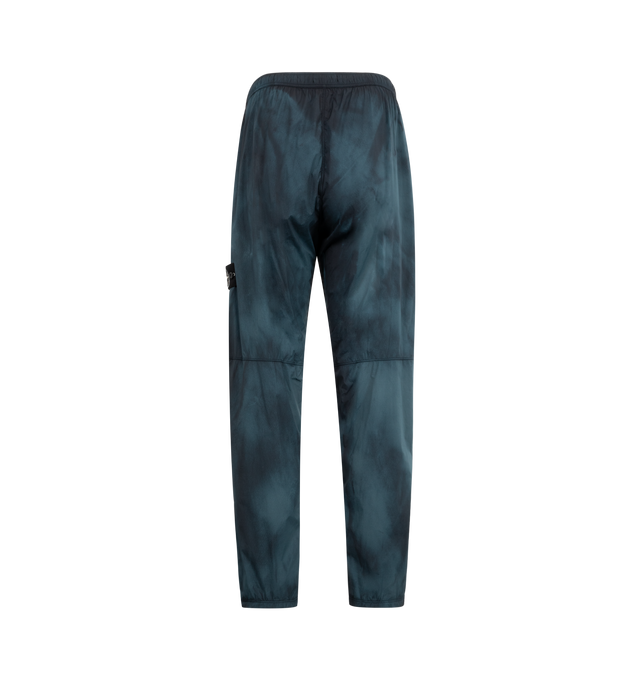 Image 2 of 3 - BLUE - STONE ISLAND Trousers featuring elastic waist, zipper side pockets, logo patch and drawstring on hem. 