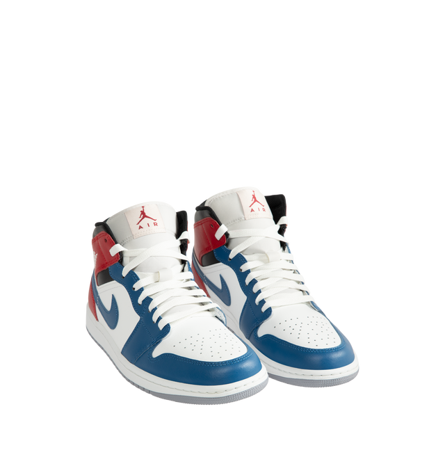 Image 2 of 5 - MULTI - Men's Air Jordan 1 Mid Sneakers feature a leather, synthetic leather, and textile upper with the iconic mid-top silhouette for a timeless heritage look. These lifestyle sneakers combine lightweight Nike Air cushioning, a foam midsole, and a durable rubber outsole with a pivot-circle traction pattern for lasting comfort, support, and reliable grip. Main Material: Leather, Synthetic Leather, and Textile. Midsole: Foam with Nike Air Cushioning. Sole: Rubber. 