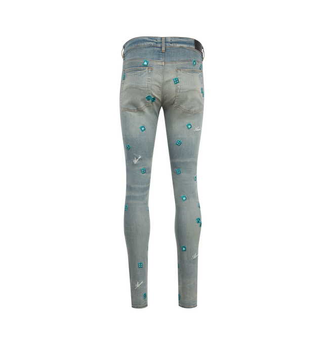 Image 2 of 3 - BLUE - Amiri Dice Skinny Jeans are a 5-pocket style designed in Italian stretch denim with embroidered dice and the house script logo. 92% cotton, 6% elastomultiester, 2% elastane. Made in USA.  