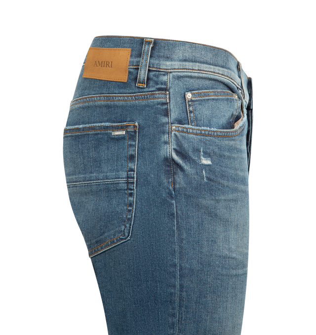 Image 3 of 3 - BLUE - AMIRI Skinny Jean featuring five-pocket style, full length, fitted through skinny legs, button zip fly and belt loops. 92% cotton, 8% elastane. 