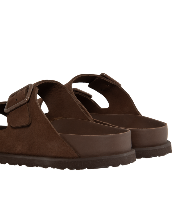 Image 3 of 4 - BROWN - Birkenstock's Arizona sandals in a regular width. The iconic Arizona sillhouette is  updated in suede featuring adjustable straps with buckle closures, logo details, shaped insole, and EVA outsole. Upper: Luxurious fine flesh out suede, a full grain leather that has been flipped to use the fuzzy side. Footbed: Anatomical shaped BIRKENSTOCK cork-latex footbed, covered with premium, color-matching smooth nappa leather. Sole: EVA outsole with a 3mm EVA welt updates the standard die-cut o 