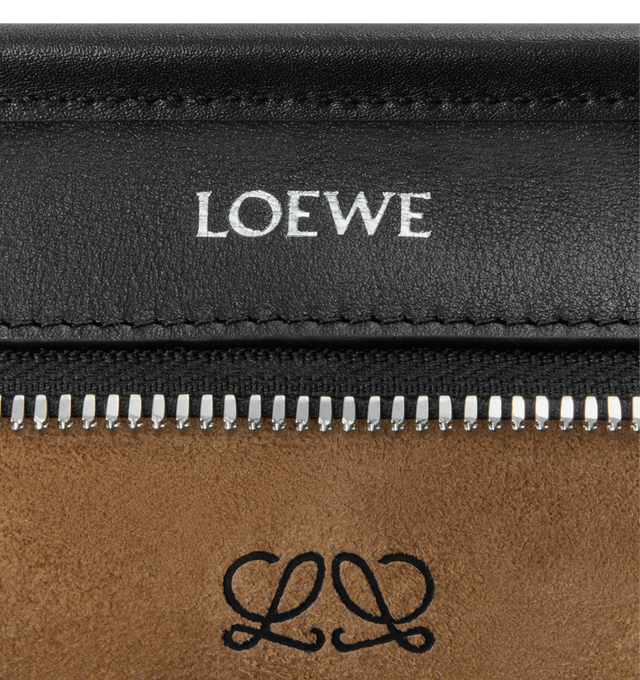 Image 14 of 16 - BLACK - Loewe Small Amazona 180 Bag in leather features a relaxed silhouette anchored by a single toron top handle, designed to be carried open, while a concealed closure secures the main compartment, three carry options: short handle, removable shoulder strap and crossbody, zip closure with two leather zip pullers, two compartments, main compartment closed with magnetic closure, internal flat pocket, left side d-ring for customization, nappa lambskin lining, and embossed double L branding. 