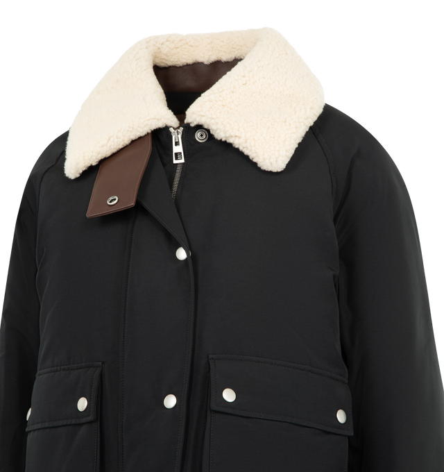 Image 5 of 5 - BLACK - LOEWE Puffer in shearling and cotton blend featuring a detachable shearling vest and collar, regular fit, short length, leather chin strap, snap button and concealed zip front fastening, buttoned gusset flap pockets and LOEWE Anagram embossed leather patch placed at the back. Cotton, polyamide. Made in Italy. 