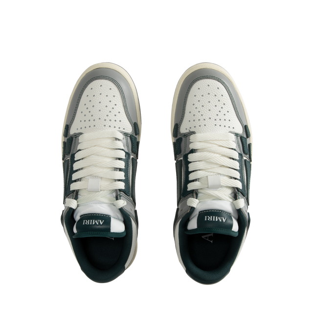 Image 5 of 5 - GREEN - Amiri Varsity Skel Top Low Sneakers are a lace-up style with perforation details, signature graphics, leather appliques, and two-tone rubber soles. Leather uppers. Made in Vietnam.  