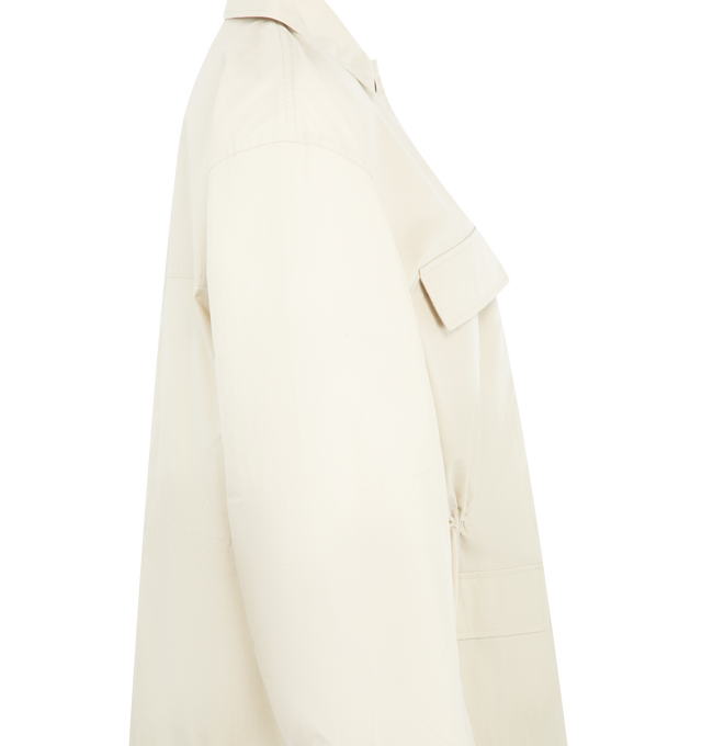 Image 3 of 3 - WHITE - TOTEME Collared Drawstring Jacket featuring utility jacket with an oversized fit, rounded, dropped shoulders, unlined cotton twill, front flap pockets, a concealed placket with top button visible and internal drawstring. 60% organic cotton, 40% recycled polyamide. 