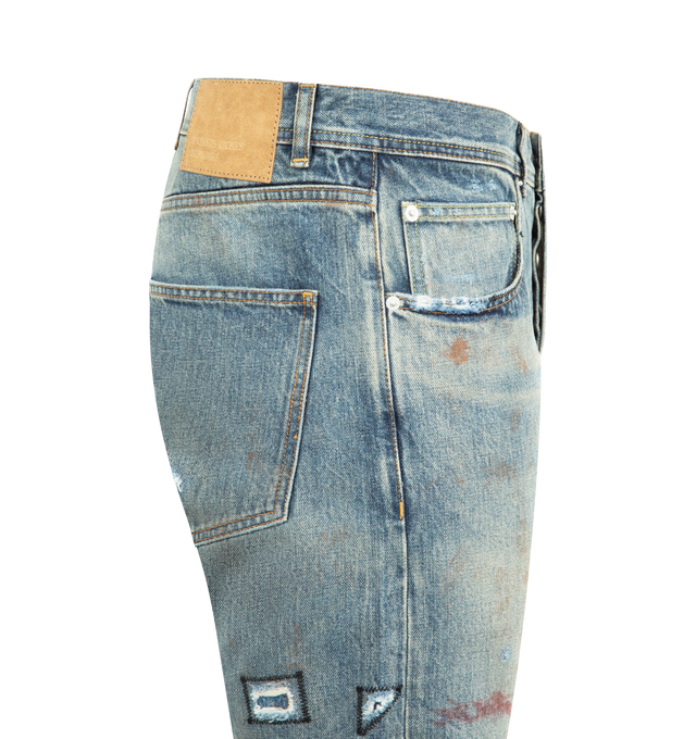 Image 3 of 3 - BLUE - ENFANTS RICHES DEPRIMES Elvis Texas Flare Jeans featuring 14oz Japanese cotton denim, mid-rise, slightly flared silhouette, five-pocket styling, a button fly, belt loops at the waistband, ERD-branded hardware, an embossed logo patch at the back waistband, raw hem leg openings and a heavy vintage wash and distressing throughout. 