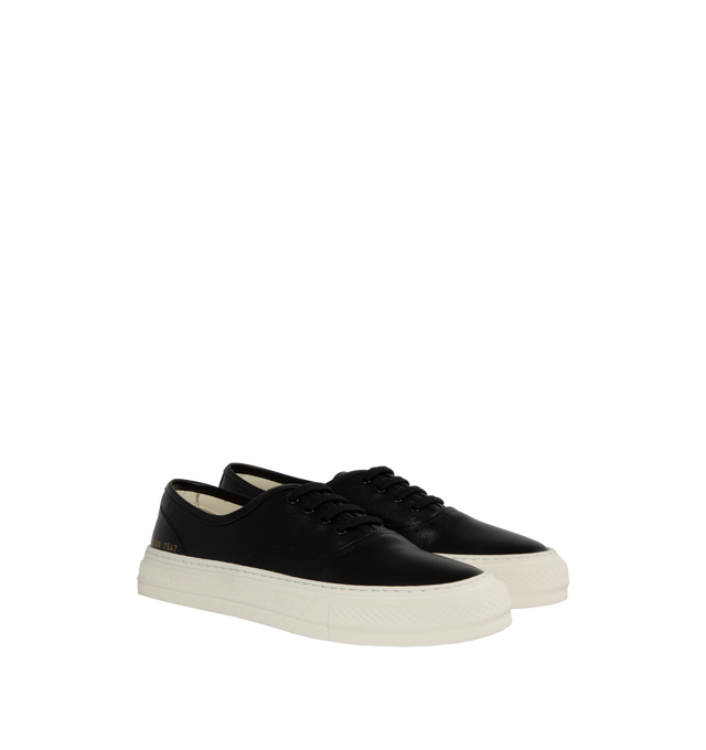 Image 2 of 5 - BLACK - Common Projects Four Hole Lace-Up Sneakers in a low-top design with flat sole, front lace-up fastening, round toe detailed with signature gold number stamp at the heel. Made in Italy. 
