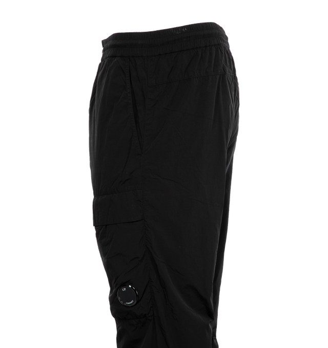 Image 3 of 3 - BLACK - C.P. COMPANY Chrome-R Loose Cargo Pants featuring adjustable drawstring waistband, button and zip fastening, side pockets, cargo flap pockets with Lens detail, back flap pocket with embroidered logo patch, mesh lining, garment dyed and loose fit. 