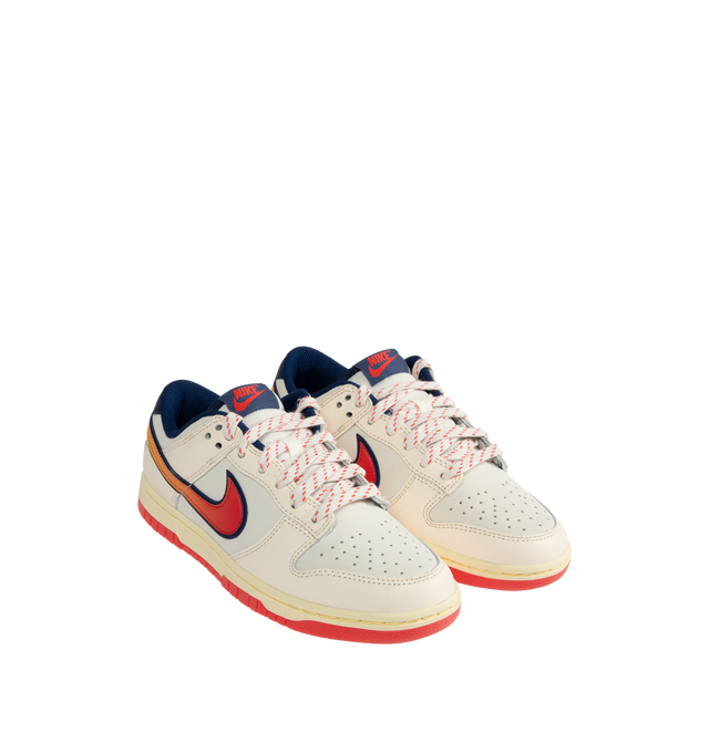 Image 2 of 5 - WHITE - NIKE Dunk Low Retro SE Sneaker featuring genuine leather upper, foam midsole, rubber outsole with classic pivot circle, padded collar and perforated toe box. 