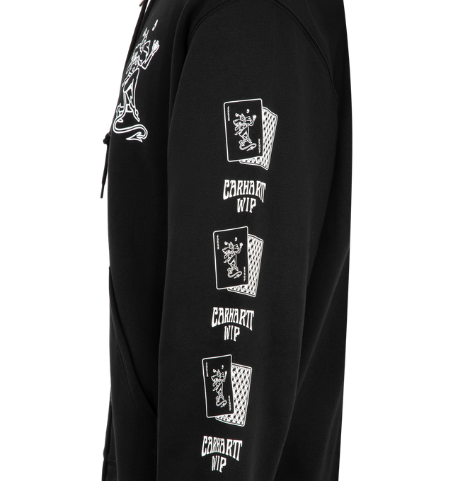 Image 3 of 3 - BLACK - Carhartt WIP Men's Hooded Playing Cards Jacket is crafted from heavyweight brushed cotton-blend jersey and features a balloon fit with dropped shoulders, an adjustable hood, a kangaroo pocket, and graphic Playing Cards prints across the chest and sleeves. This designer hooded sweatshirt combines premium fleece-backed comfort with bold seasonal artwork, creating a relaxed everyday essential with a contemporary streetwear aesthetic. Main Material: 80% Cotton, 20% Polyester (425 gsm). Fi 