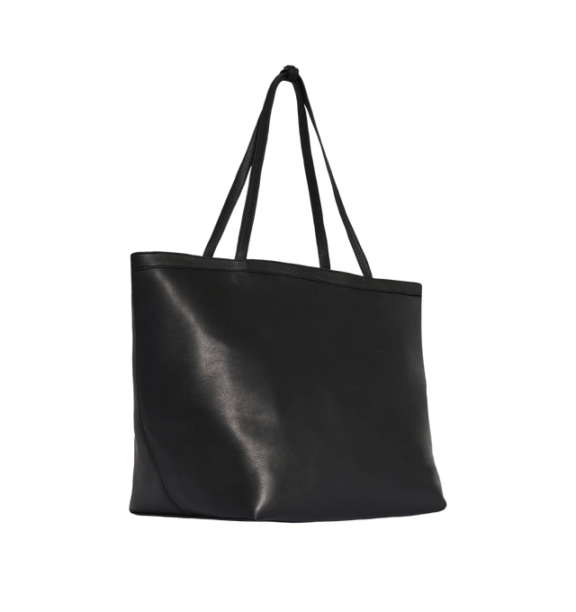 Image 2 of 3 - BLACK - THE ROW XL Stitched Park Tote Bag featuring classic tote bag in polished saddle leather with interior tie closure, textured calfskin leather trim and removable interior wristlet with adjustable strap. 23 x 11.75 x 13.75 in. Handle: 10.5 in. drop. Antique silver hardware finishing. 100% calfskin leather. Lined in 100% lambskin leather. Made in Italy. 