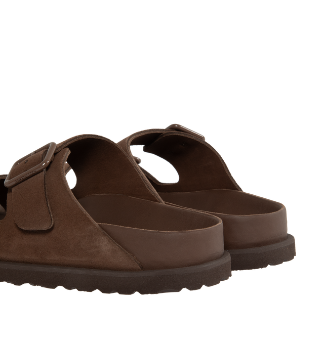 Image 3 of 4 - BROWN - Birkenstock's Arizona sandals in a narrow width. The iconic Arizona sillhouette is  updated in suede featuring adjustable straps with buckle closures, logo details, shaped insole, and EVA outsole. Upper: Luxurious fine flesh out suede, a full grain leather that has been flipped to use the fuzzy side. Footbed: Anatomical shaped BIRKENSTOCK cork-latex footbed, covered with premium, color-matching smooth nappa leather. Sole: EVA outsole with a 3mm EVA welt updates the standard die-cut ou 