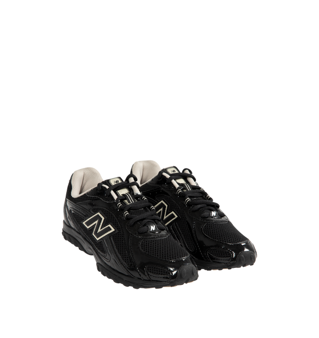 Image 2 of 5 - BLACK - NEW BALANCE 204L Sneaker featuring multi-piece upper with embossed overlay, screen-printed graphics along the saddle, distinctive outsole with 2000s-inspired strike path and 70s-influenced tread pattern, double-stacked synthetic leather and reflective 'N' logo, patent leather and mesh upper and EVA outsole. 