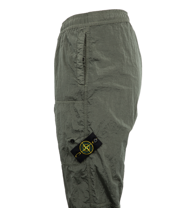 Image 3 of 3 - GREEN - Stone Island Pantalone Regular Trousers have a tapered style with elastic cuffs and an elastic waist.  