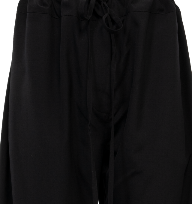 Image 4 of 4 - BLACK - THE ROW Argent Pants featuring mid rise, sits high on hip, drawstring waistband, side pockets, oversized silhouette, straight fit, full length and pull-on style. Silk/cotton. Silk lining. Made in Italy. 