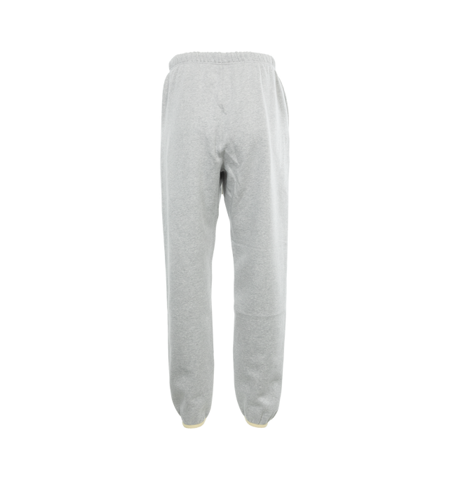 Image 2 of 4 - GREY - FEAR OF GOD ESSENTIALS Drawstring Sweatpants featuring drawstring at elasticized waistband, two-pocket styling, rubberized logo patch at front and elasticized cuffs. 80% cotton, 20% polyester. Made in Viet Nam. 