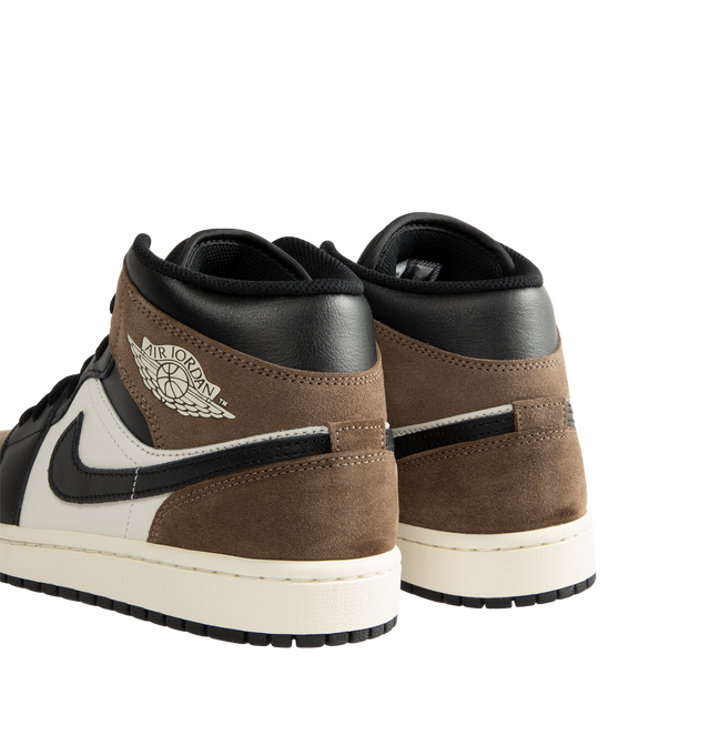 Image 3 of 5 - MULTI - Men's Air Jordan 1 Mid Sneakers feature a smooth leather upper with the iconic mid-top silhouette, breathable perforated toe box, and a padded collar for a timeless heritage look. These lifestyle sneakers combine a foam midsole with encapsulated Air-Sole cushioning and a durable rubber outsole with concentric traction for lightweight comfort, lasting support, and reliable everyday grip. Main Material: Leather. Midsole: Foam with Encapsulated Air-Sole Unit. Sole: Rubber.  