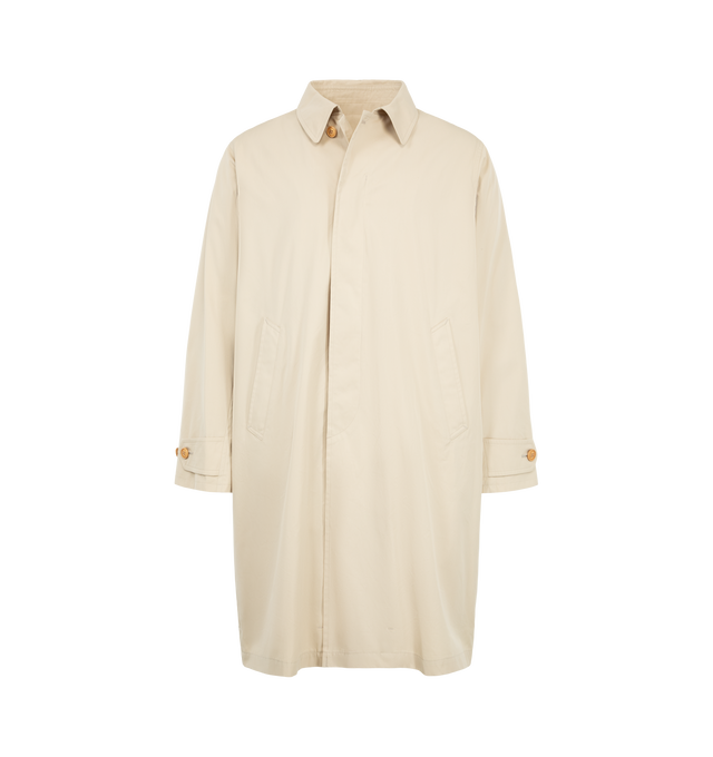 Image 1 of 3 - CREAM - Visvim Bochco Soutien Coat is crafted from custom-treated cotton nylon pinpoint oxford cloth and features a classic soutien coat silhouette with a concealed front closure, custom water buffalo buttons, and a custom zip fastener. Designed for versatility across seasons, this elevated outerwear style is finished with a detachable custom-treated wool fleece lining and a one-wash treatment for a softened, lived-in feel. Main Material: 81% Cotton, 19% Nylon. Made in Japan. 