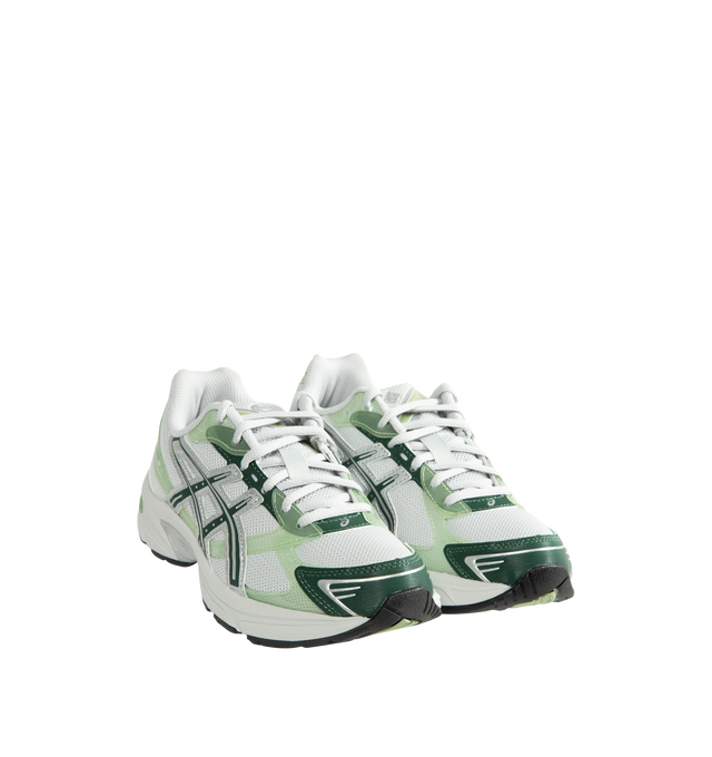 Image 2 of 5 - GREEN - Asics Unisex Gel-1130 Sneakers feature patent leather overlays, clear gloss TPU accents, and breathable mesh underlays for a modern look. Enhanced with cushioning and support designed for all-day comfort, the GEL-1130 delivers the perfect blend of heritage performance and everyday wearability. Main Material: Mesh Upper with Patent Leather and Gloss TPU Overlays. Cushioning: GEL Technology. Details: GEL-1000 Series Heritage Design, Breathable Mesh Construction *Unisex style in men's si 