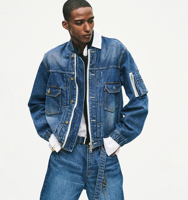 Image 4 of 5 - BLUE - Sacai X Levi's Men's Belted Wide leg pants are crafted from a medium-dark wash cotton denim and feature a high-rise waist, wide-leg silhouette, a buckled belt, signature Levi back-pocket design, and utility-inspired patch pockets. Main Material: 100% Cotton. Made in Japan. 