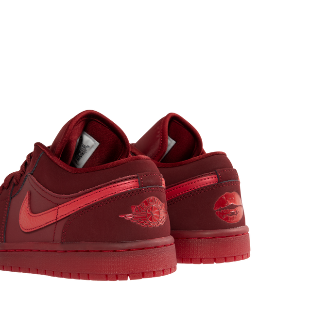 Image 3 of 5 - RED - JORDAN Air Jordan 1 Low SE Sneaker featuring leather in the upper, encapsulated Nike Air-Sole unit provides lightweight cushioning, rubber in the outsole, lace up closure, wings logo on heel and Jumpman on tongue. 