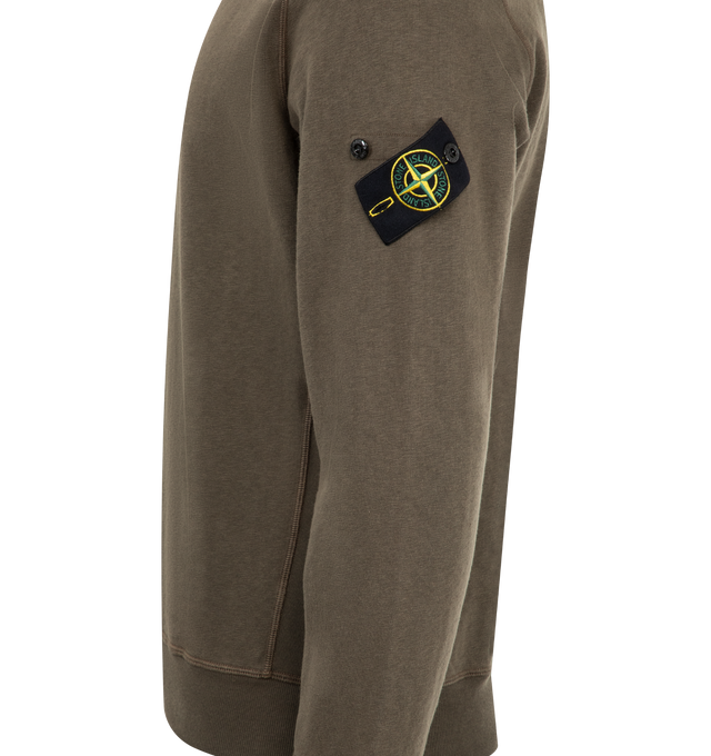 Image 3 of 3 - GREEN - Stone Island Sweatshirt has a ribbed neckline, overlock seams, Stone Island badge on the left sleeve, ribbed cuffs and bottom band and regular fit. 100% cotton.  