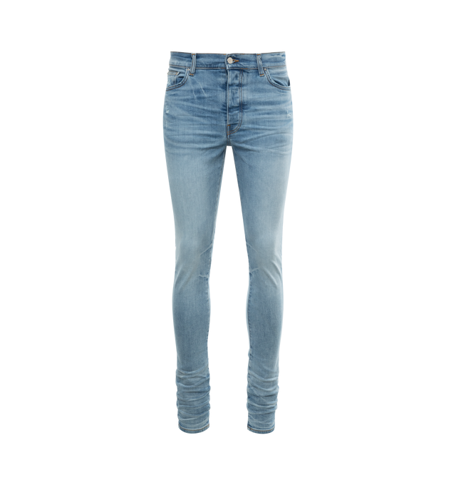 Image 1 of 2 - BLUE - AMIRI Stack Jeans featuring skinny-fit stretch denim, fading, whiskering, and distressing throughout, belt loops, five-pocket styling, button-fly, leather logo patch at back waistband and logo-engraved silver-tone hardware. 92% cotton, 6% elastomultiester, 2% elastane. Made in United States. 