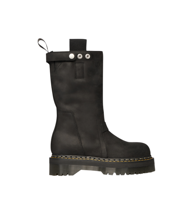 Image 1 of 7 - BLACK - Dr. Martens x Rick Owens FW26 Quad Sole Pull On Boot in Nubuck Leather. These Men's Dr. Martens boots are reimagined by Rick Owens and are mid-calf height with a steel toe cap and palladium-finish hardware, including snaps and a side zipper. They feature a topstitched seam arcing over the front foot, a stitched heel counter, two side pull tabs, and a woven Dr. Martens AirWair heel loop in black and pearl. The boots are finished with a Quad sole and a yellow and pearl welt stitch. This 
