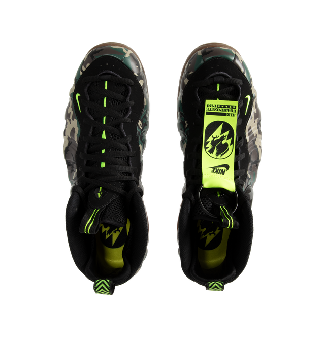 Image 5 of 5 - MULTI - The Men's Nike Air Foamposite Pro Army Camo (2026) reimagines the iconic basketball silhouette with a rugged, military-inspired aesthetic. The molded Foamposite upper features a camouflage finish in black and Voltage Green, balanced by a Gum Dark Brown outsole for a bold yet versatile look. 