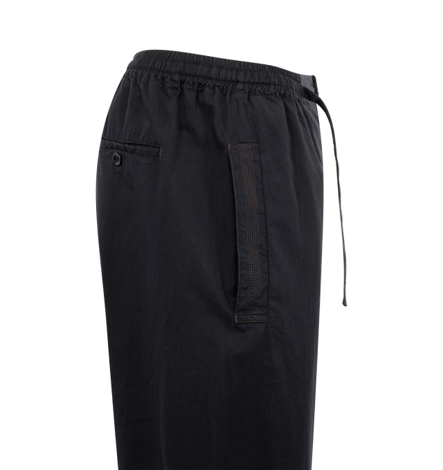 Image 3 of 3 - BLACK - Lemaire Multi-Topstitch Taekwondo Pants have an elastic drawstring waist, pleat detailing, 2 side pockets, and a rear button pocket.  