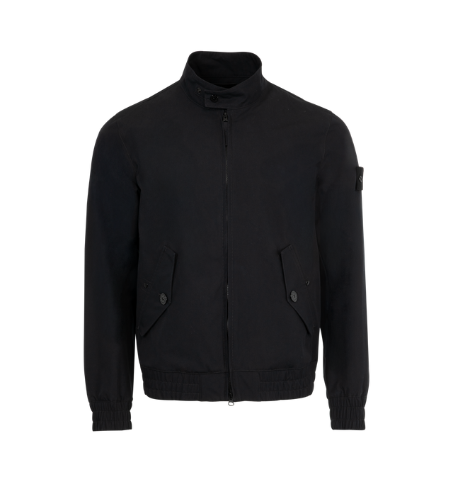 Image 1 of 3 - BLACK - Stone Island Bomber Jacket has a ribbed bomber collar, side pockets with flaps and snaps, a brand logo badge on the sleeve, ribbed cuffs and hem, and a 2 way zipper closure with a button placket. Padded with PrimaLoft-TC. External Fabric: 100% polyamide/nylon exterior. Made in Vietnam.  