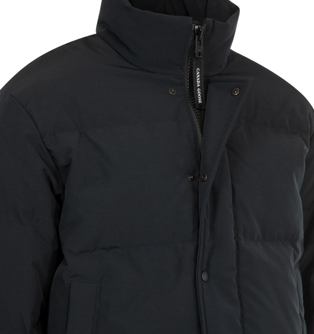 Image 4 of 4 - BLACK - CANADA GOOSE Bayview Parka Black Label featuring placket with snap buttons over two-way zipper, recessed rib-knit cuffs, brushed tricot-lined chin guard, hem with interior drawcord, interior backpack straps for hands-free carrying capabilities, two exterior fleece-lined pockets with snap closures, two interior mesh drop-in pockets and one zippered security pocket. 85% recycled polyester, 15% organic cotton. 