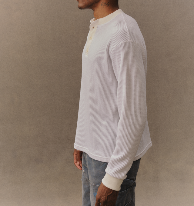 Image 5 of 6 - WHITE - Cherry LA Men's Henley Thermal is crafted from a custom poly-cotton thermal fabric and features a fitted silhouette with a classic Henley neckline. Designed with embroidered detailing at the back and finished with two-hole cat-eye buttons, this everyday essential combines vintage-inspired thermal styling with Cherry LA's signature craftsmanship. Main Material: Custom Poly-Cotton Thermal. Made in Los Angeles, California. 