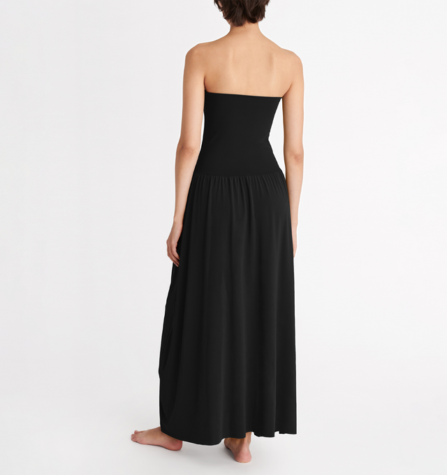 Image 3 of 5 - BLACK - ERES Oda Long Dress featuring long bustier dress with a raw edge finishing at the top and bottom that gives you the styling option to wear it as a long skirt. Main: 94% Polyamid, 6% Spandex. Second: 84% Polyamid, 16% Spandex. Made in France. 