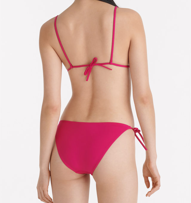 Image 5 of 6 -  PINK - ERES Malou Thin Bikini Brief Bottoms featuring side ties. Main: 84% Polyamid, 16% Spandex. Second: 68% Polyamid, 32% Spandex. Made in France. 
