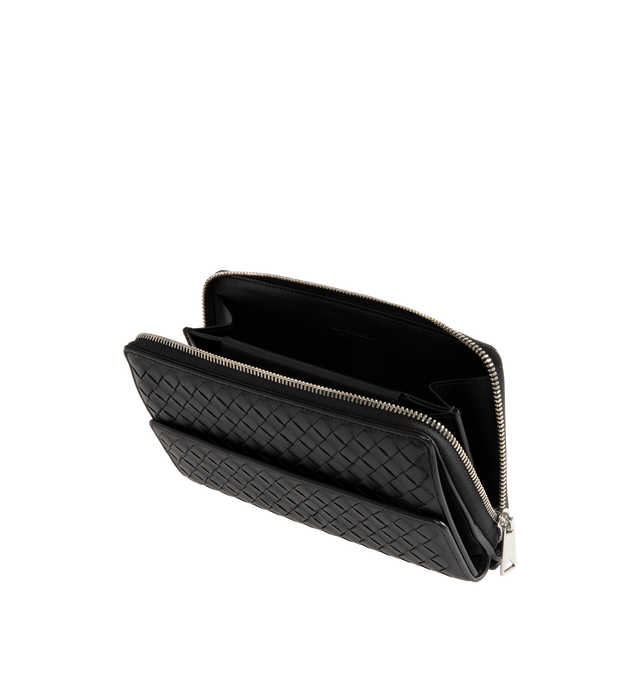 Image 3 of 3 - BLACK - Bottega Veneta Mens Zip-Around Organizer is crafted from Intrecciato piccolo calfskin leather. Features a zip-around closure, six card slots, two bill compartments, one coin pocket, one exterior pocket, calfskin lining, and silver-finish hardware. Main Material: Calfskin Leather; Lining: Calfskin Leather. Made in Italy. 