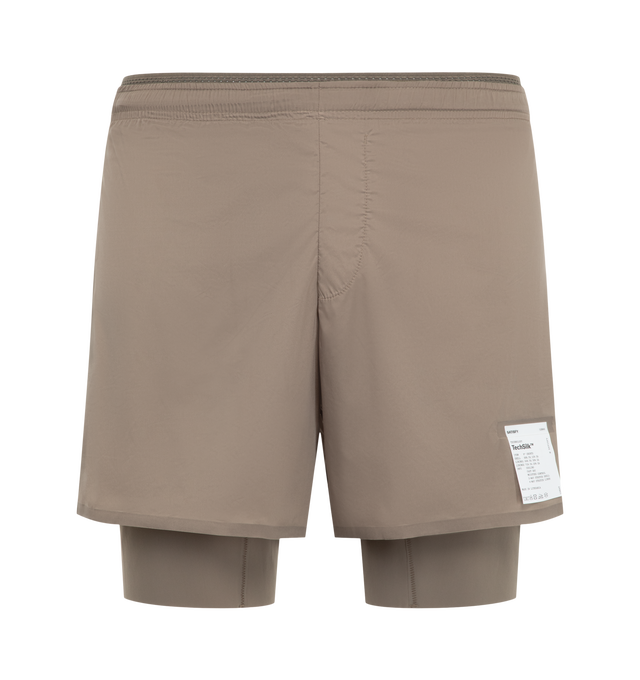 Image 1 of 3 - NEUTRAL - Satisfy Men's TechSilk 8" Shorts are crafted from lightweight French-engineered TechSilk and feature a 5-inch shell paired with an 8-inch Justice TechSilk Evo liner. Designed for long-distance performance, the fast-drying construction is enhanced with Coldblack treatment for cooling, odor control, UV protection, and four-way stretch. Functional details include a sweat-resistant hidden phone pocket, double waistband with internal drawcords, a mini S-Carabiner for keys, and reflectiv 