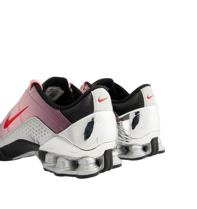 Image 3 of 5 - PINK - Nike Womens Shox Magia Sneakers feature a premium leather and textile upper. Designed with a lace-up closure, metallic accents, Nike Shox cushioning columns, and durable rubber outsole. Upper: Leather and Textile; Cushioning: Nike Shox; Outsole: Rubber. Imported 