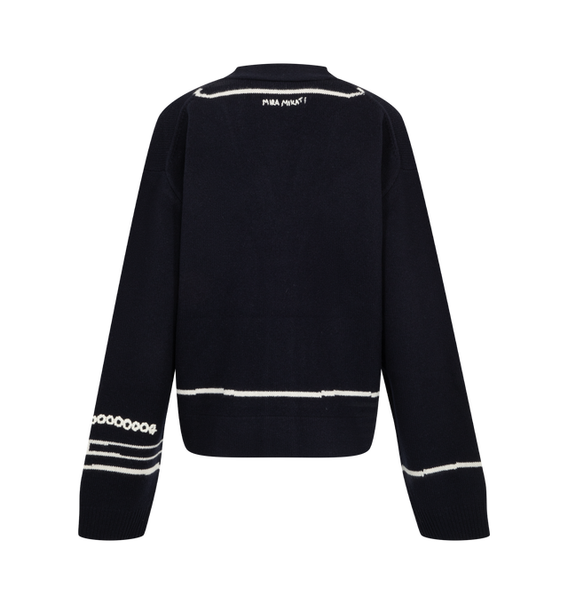 Image 2 of 2 - NAVY - Mira Mikati Women's Trompe L'Oeil Intarsia Cardigan is crafted from merino wool and features a relaxed silhouette with a trompe l'oeil intarsia design enhanced by embroidered details that create the illusion of flowers and pens tucked into the pockets and a watch at the wrist. Branded horn buttons and ribbed trims complete the design. Main Material: 100% Merino Wool.  