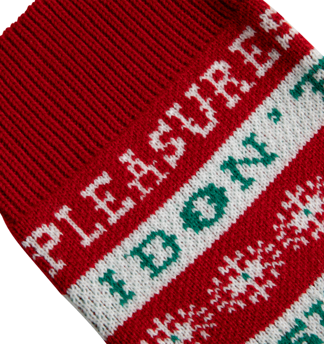 Image 2 of 2 - RED - Pleasures Naughty Holiday Stocking has a festive knit design and a ribbon to hang from a shelf or fireplace. 100% acrylic.  