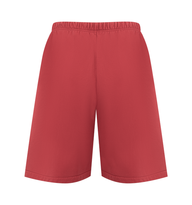 Image 2 of 3 - RED - FEAR OF GOD ESSENTIALS Relaxed Sweatshort featuring 520gsm heavy fleece treated with a pigment dye, wide-leg silhouette, bold Fear of God Essentials HD print graphic, encased elastic waistband with elongated drawcords, side seam pockets and a Fear of God Essentials rubberized label stitched at the center front. 100% cotton. 