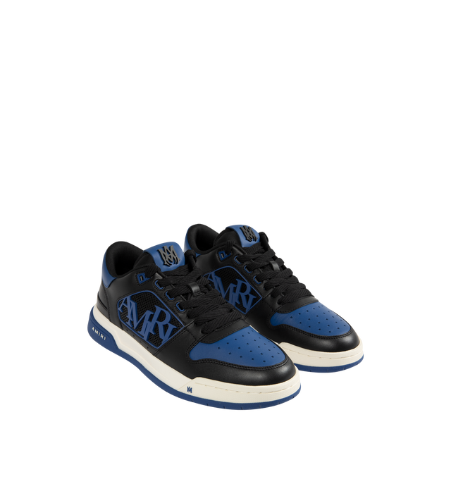 Image 2 of 5 - BLUE - AMIRI Classic Low Sneakers featuring low-top, buffed leather, graphic perforated detailing throughout, logo bonded at padded tongue, padded collar, rubberized logo appliqu at sides, logo bonded at heel counter and treaded rubber sole. Upper: leather. Sole: rubber. 