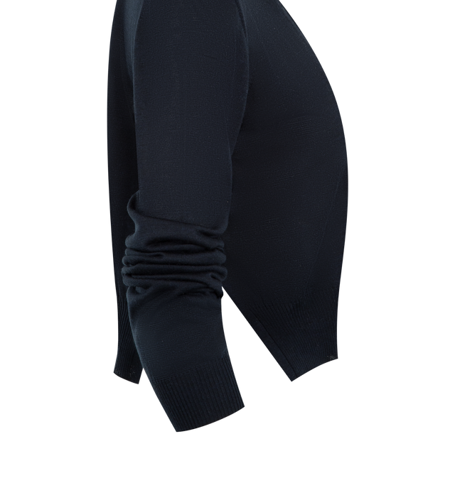 Image 3 of 3 - NAVY - KHAITE Nadyne Cardigan featuring a finely knit cardigan, compact, jersey-stitched silhouette, side slits, button front closure and 1x1 ribbing at the crewneck, bracelet-length sleeves, and hem. 95% silk, 4% polyamide, 1% polyurethane. 
