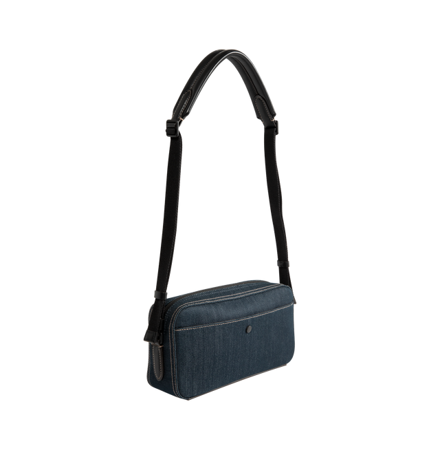 Image 2 of 3 - BLUE - Moncler Men's Carlo Denim Crossbody Bag is crafted from cotton-blend denim and features a spacious silhouette with an interior leather pocket for everyday organization. Designed with an adjustable shoulder strap, this designer crossbody bag is finished with leather trim, a micro-suede lining, an exterior snap-button pocket, an embossed logo base, and metal Moncler logo detailing. Exterior: 75% Cotton, 24% Polyester, 1% Elastane/Spandex. Lining: 100% Polyamide/Nylon. Leather Inserts: Co 