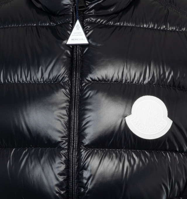 Image 3 of 3 - BLACK - MONCLER PARKE VEST is made from recycled nylon laqu, a lightweight fabric is down proof and water-repellent. The classic puffer vest features a logo patch on the chest, recycled lightweight nylon laqu lining, down-filled, zipper closure, zipped pockets and felt logo patch. Regular fit. Straight cut.EXTERIOR: 100% Polyamide / Nylon LINING: 100% Polyamide / Nylon PADDING: 90% Down, 10% Feather 
