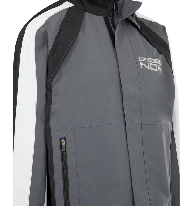 Image 4 of 4 - BLACK - PLEASURES Tactical Moto Jacket featuring relaxed fit, printed logo, hidden mesh ventilation and side zip pockets. 100% water resistant polyester. 